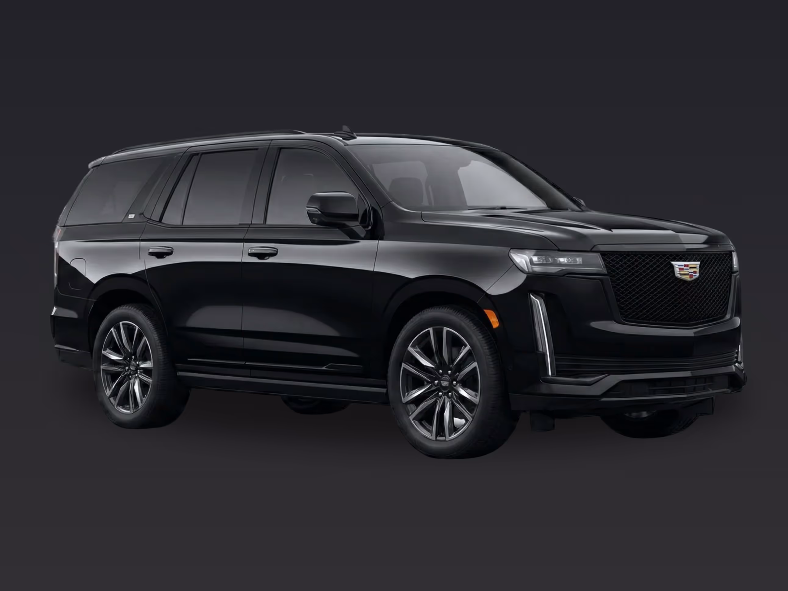 Side view of a black Cadillac Escalade luxury full-size SUV.
