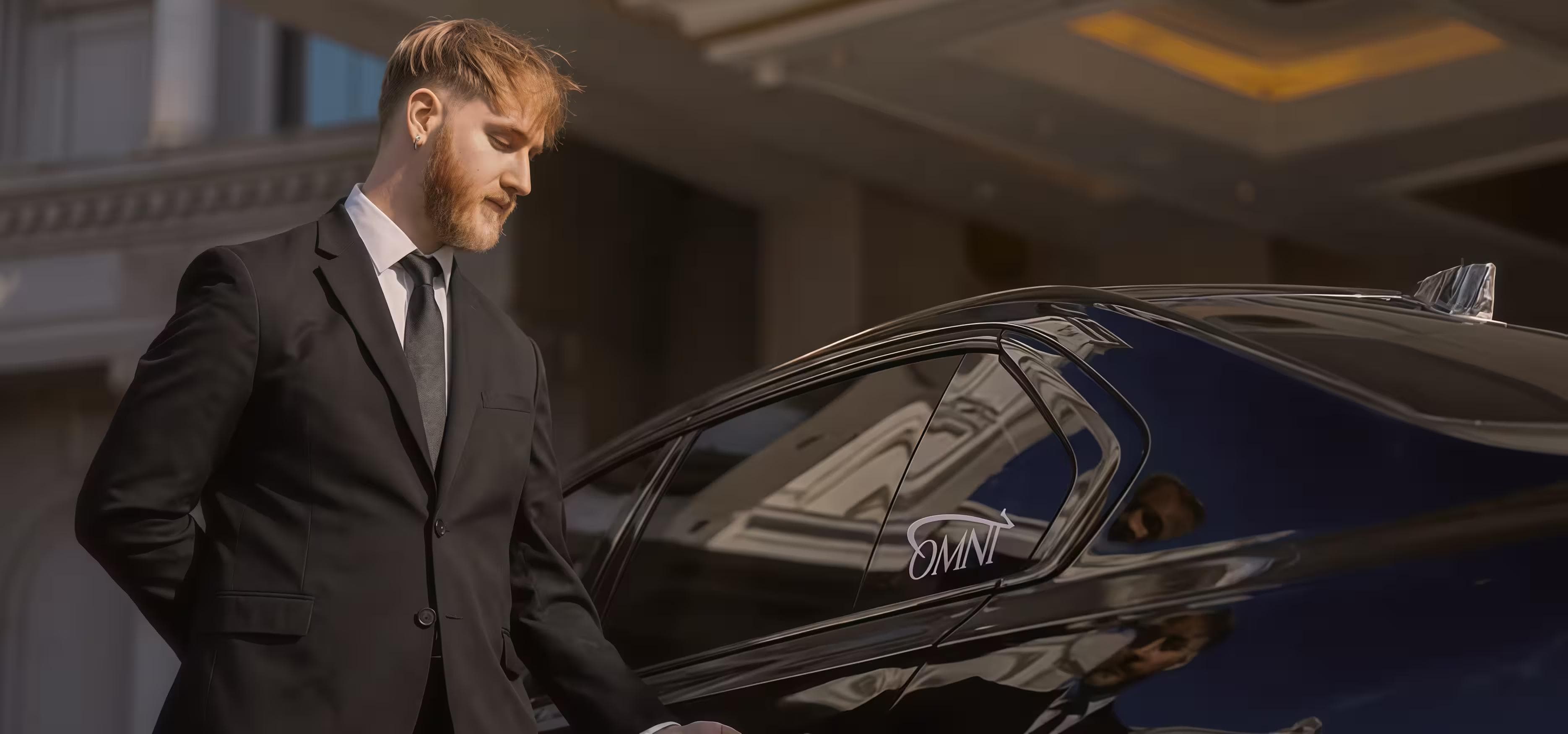Executive sedan arriving at a corporate office for professional business transport.