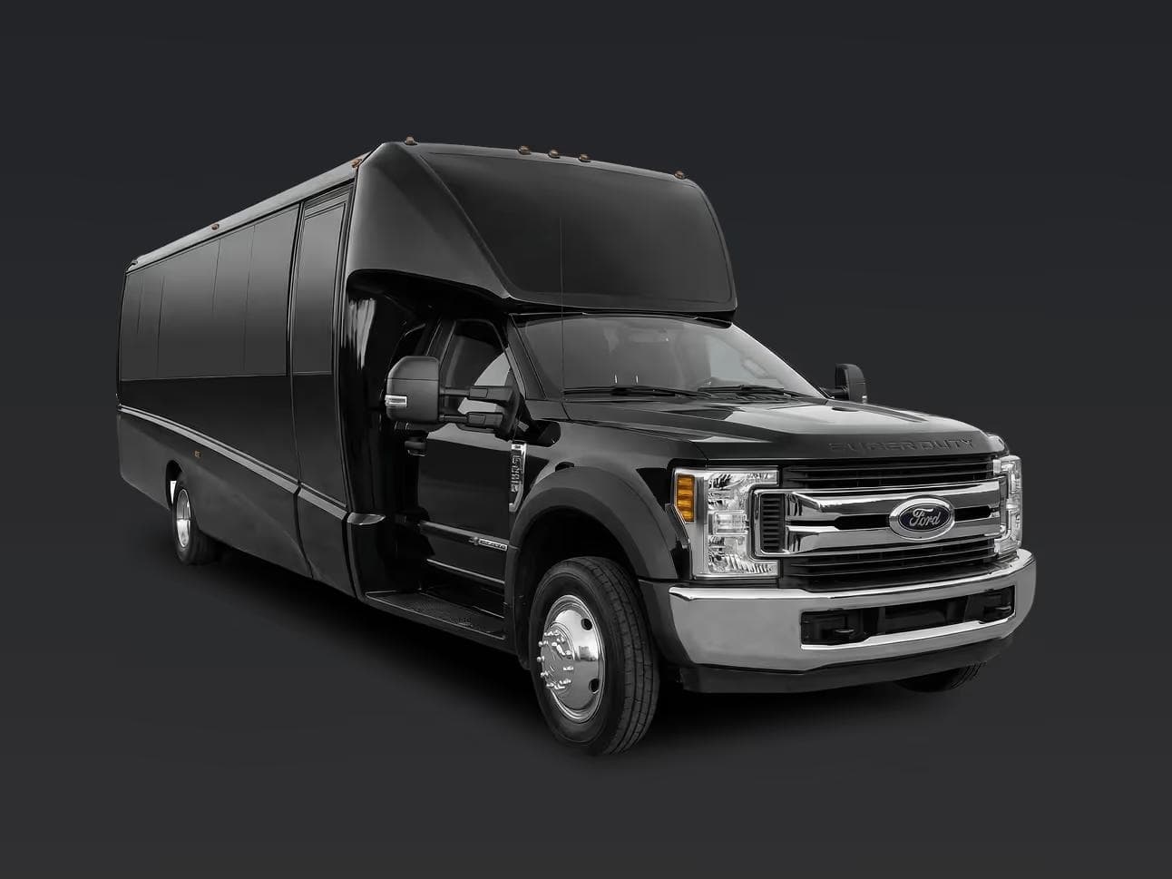 Side view of a black executive mini bus for large group charters.