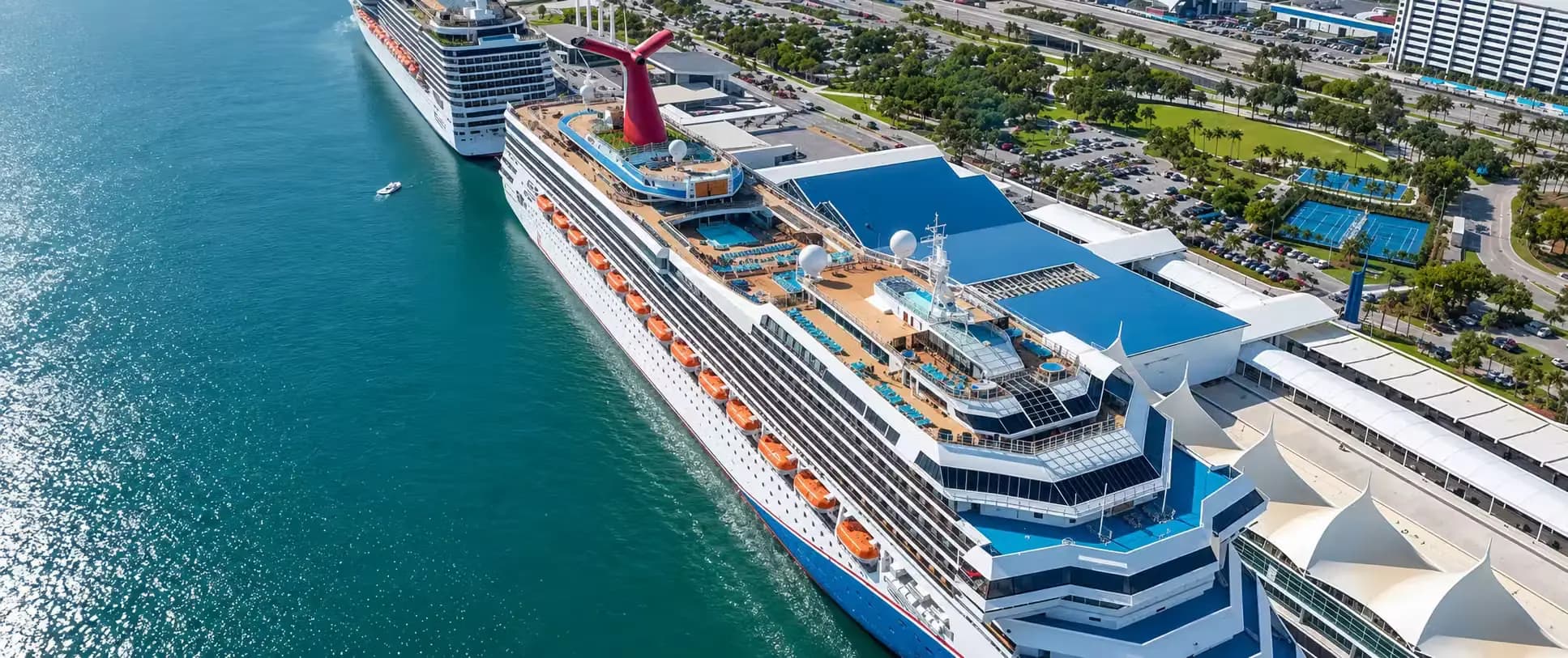Aerial view of a large cruise ship docked at PortMiami terminal