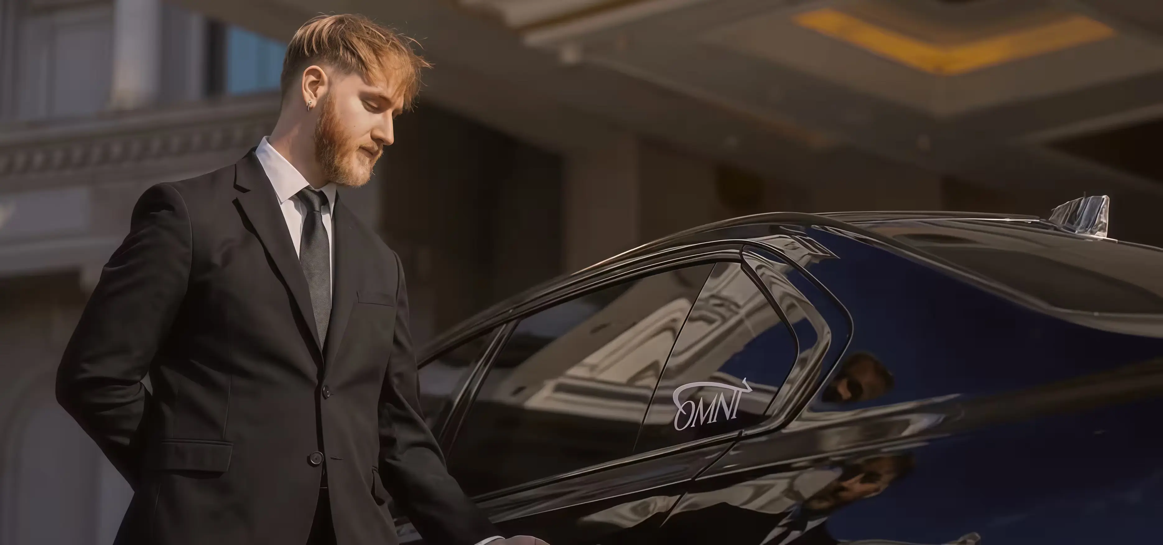 Executive sedan arriving at a corporate office for professional business transport.